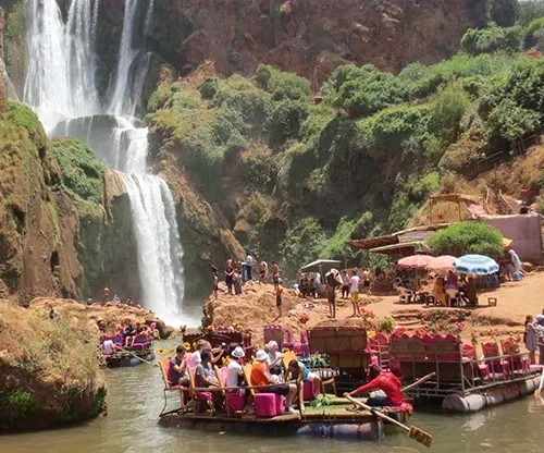 A guided tour group enjoying the view of Ouzoud Waterfalls in Morocco